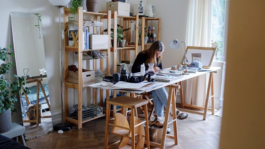 Student studying at their desk in their bedroom.