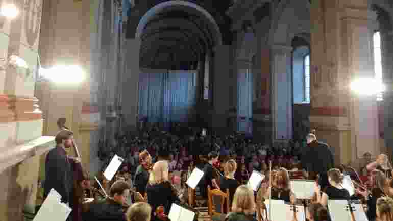 The choir and orchestra performing in Ukraine
