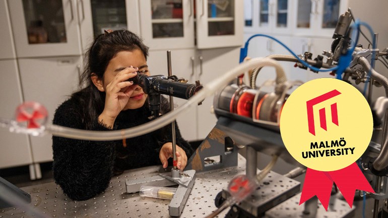 A person looking into a machine