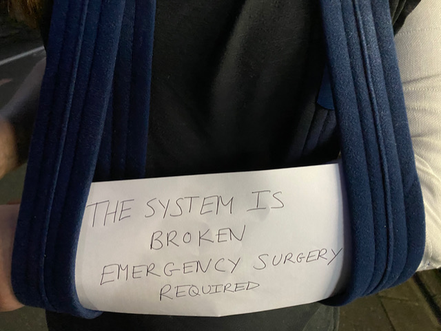 A note with the text: The system is broken emergency surgery required.