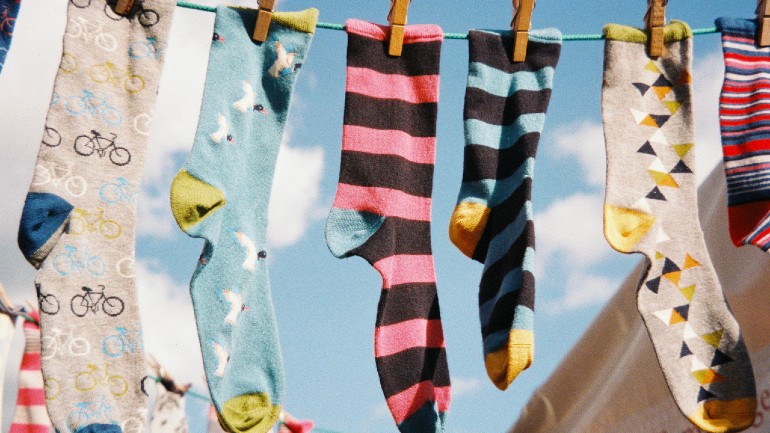 Photo of socks drying on a washing line