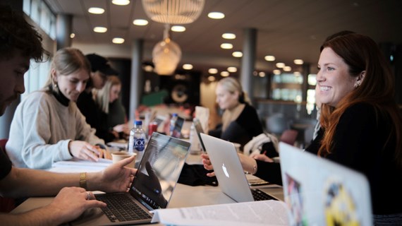 Students working together around a table.