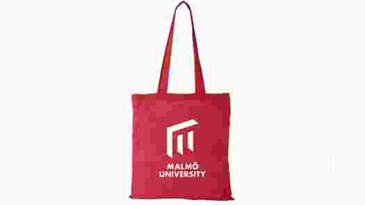 Red cotton bag with Malmö University logo.