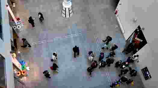 People in an atrium seen from above.