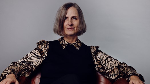 Susanna Alakoski sitting in a chair