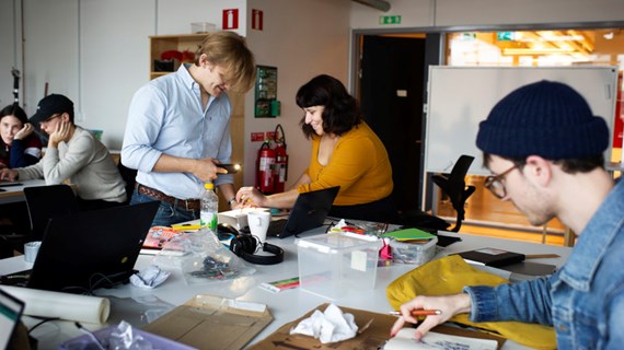 People working on projects in a classroom.